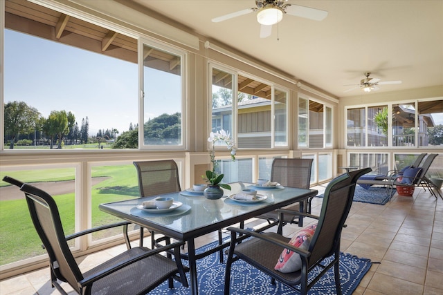 sunroom featuring ceiling fan