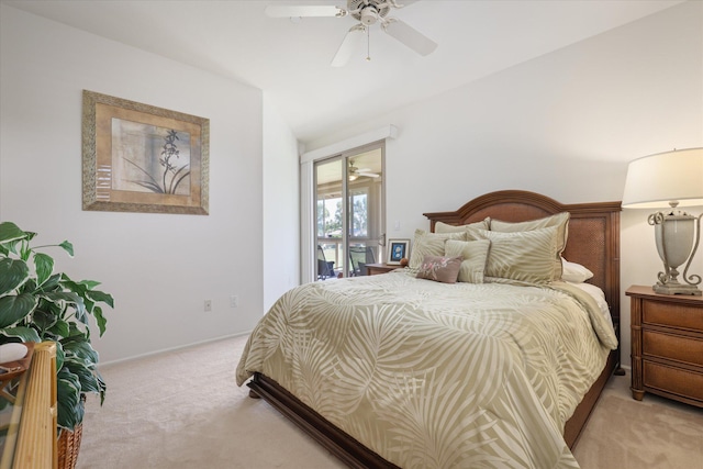 bedroom featuring light colored carpet and ceiling fan