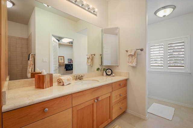 bathroom with vanity and tile patterned flooring