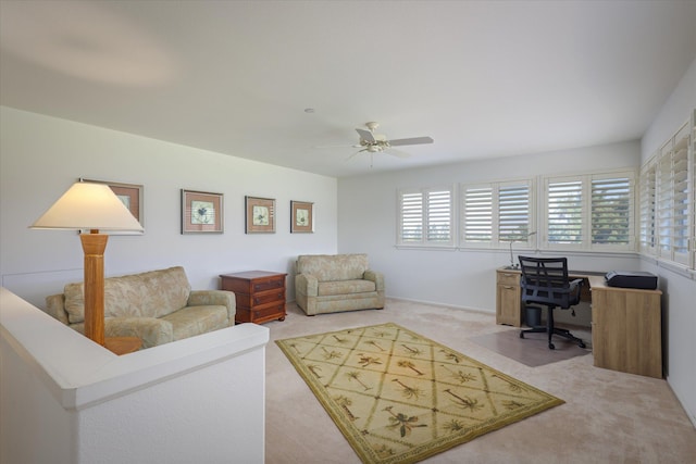 carpeted living room featuring ceiling fan