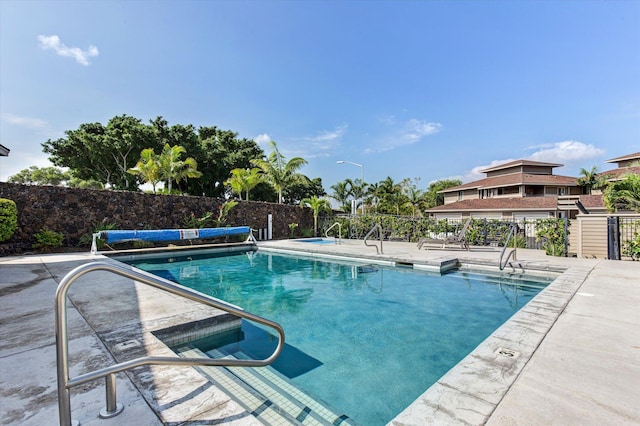 view of swimming pool featuring a patio