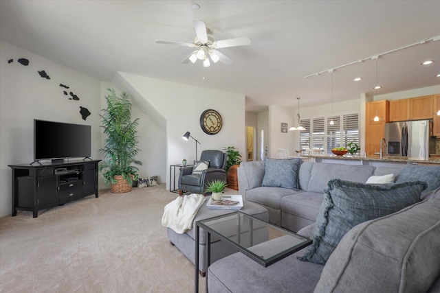 carpeted living room featuring ceiling fan