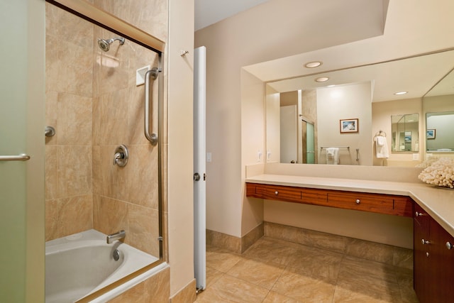 bathroom featuring vanity, tile patterned flooring, and tiled shower / bath combo