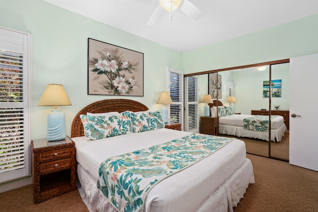 carpeted bedroom featuring ceiling fan and a closet