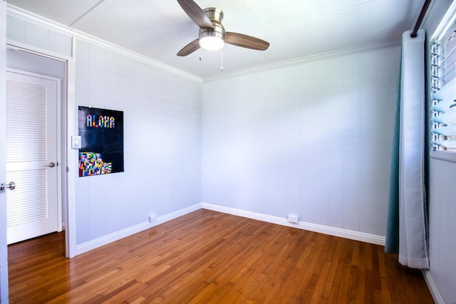 unfurnished room featuring hardwood / wood-style flooring, crown molding, and ceiling fan