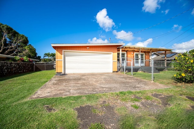 view of front of house featuring a garage and a front lawn