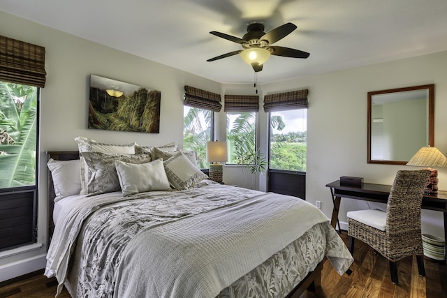 bedroom with dark wood-type flooring and ceiling fan