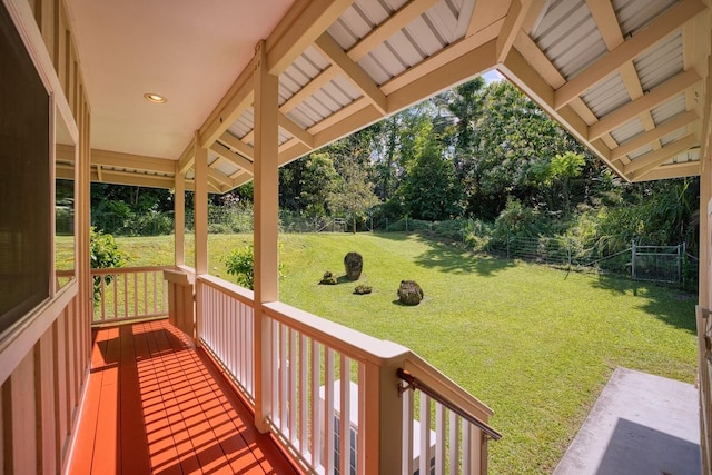 wooden terrace with a yard