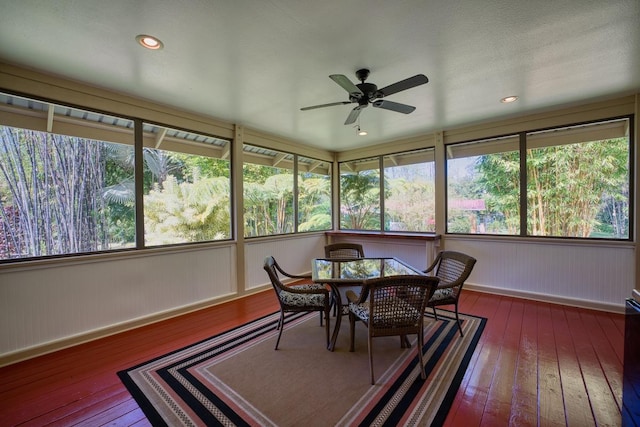 sunroom / solarium featuring ceiling fan and a healthy amount of sunlight