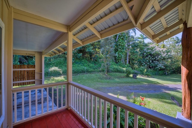 wooden terrace with a yard and a porch