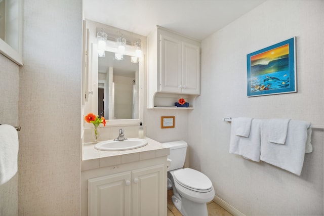 bathroom featuring toilet and vanity