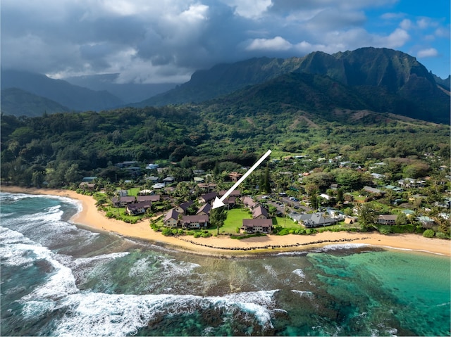 exterior space with a water view and a beach view