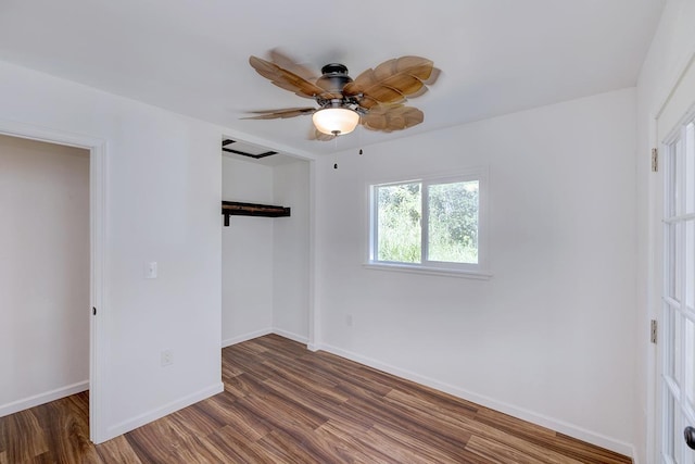 unfurnished bedroom featuring dark wood-type flooring, ceiling fan, and a closet