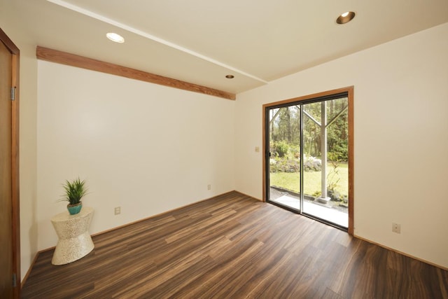 spare room with dark hardwood / wood-style floors