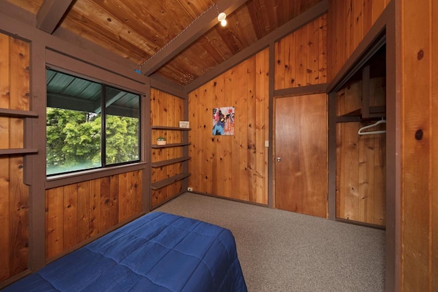 bedroom with vaulted ceiling with beams, wood ceiling, wooden walls, and dark colored carpet