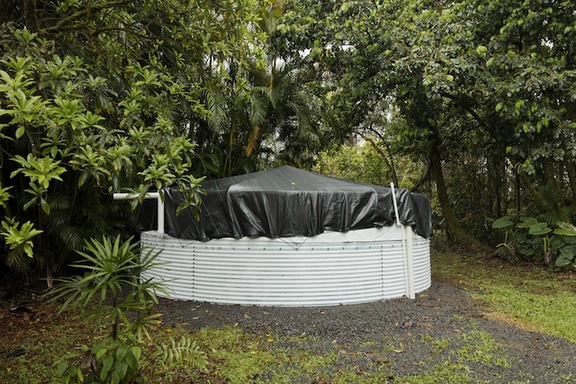 view of yard with a pool