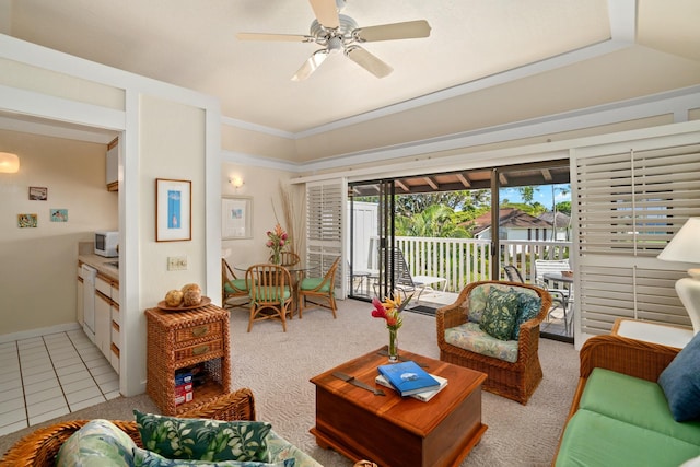 tiled living room featuring ceiling fan and crown molding