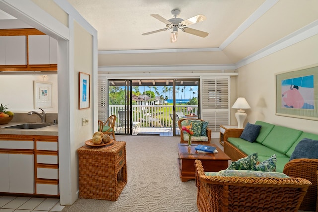 living room featuring ceiling fan, light colored carpet, vaulted ceiling, sink, and ornamental molding