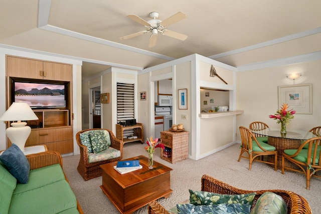 living room with ceiling fan and light colored carpet