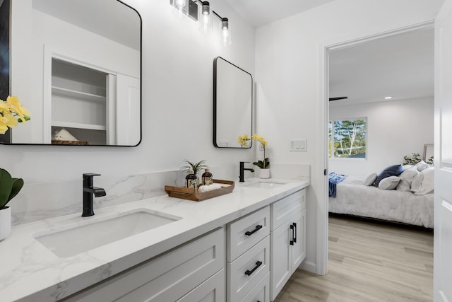 bathroom featuring vanity and hardwood / wood-style floors