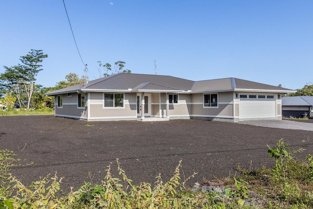 single story home with a garage