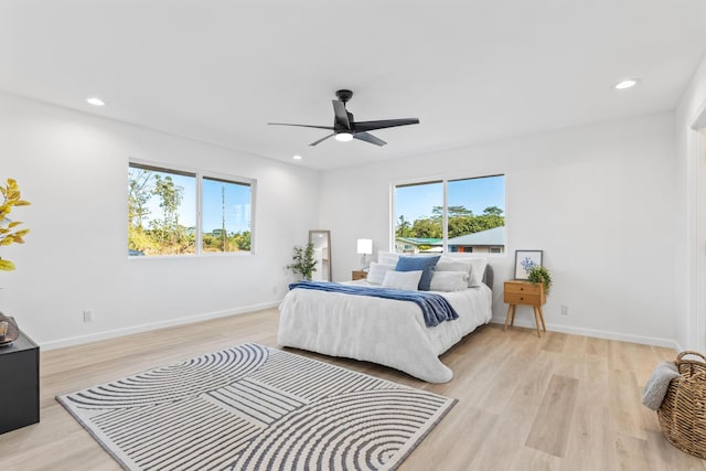 bedroom featuring ceiling fan and light hardwood / wood-style flooring