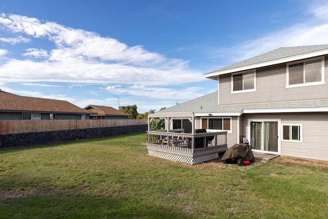 view of yard with a wooden deck