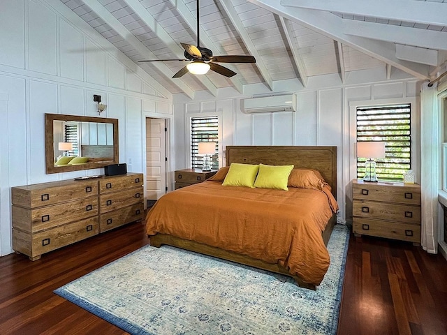 bedroom with a wall mounted air conditioner, multiple windows, and dark wood-type flooring