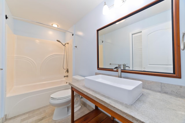 full bathroom featuring toilet, sink, and shower / bathing tub combination