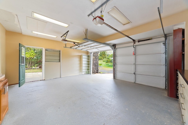 garage featuring a carport and a garage door opener