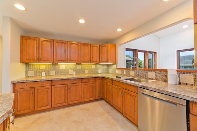 kitchen with sink, light tile patterned floors, and dishwasher