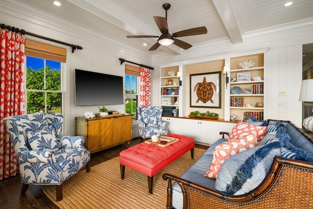 living room featuring crown molding, wood-type flooring, beam ceiling, and built in features