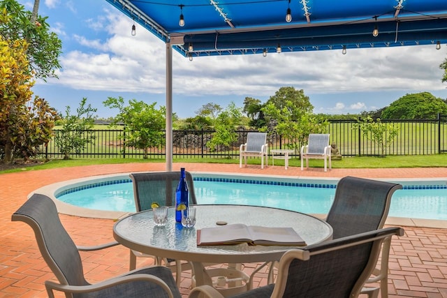 view of swimming pool featuring a patio