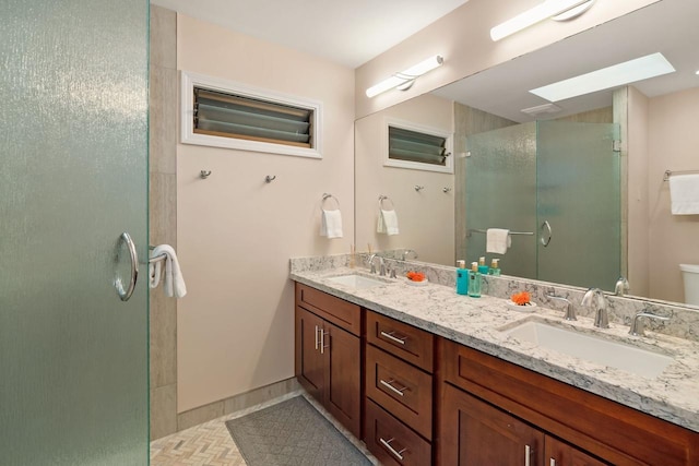 bathroom with tile patterned floors, walk in shower, and vanity