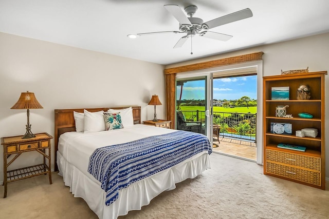 carpeted bedroom featuring ceiling fan and access to outside