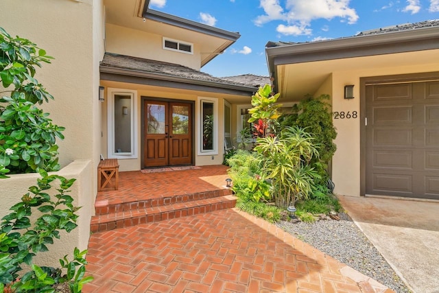 property entrance featuring french doors