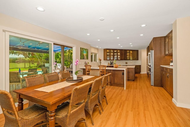 dining area with light hardwood / wood-style flooring