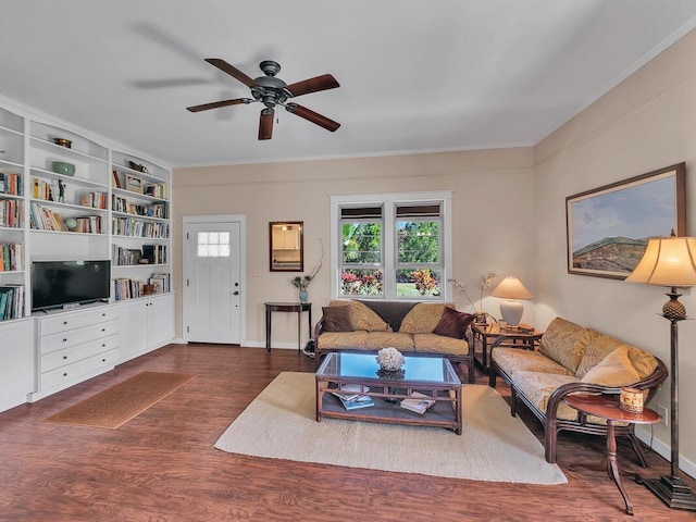 living room featuring ceiling fan, crown molding, and dark hardwood / wood-style flooring