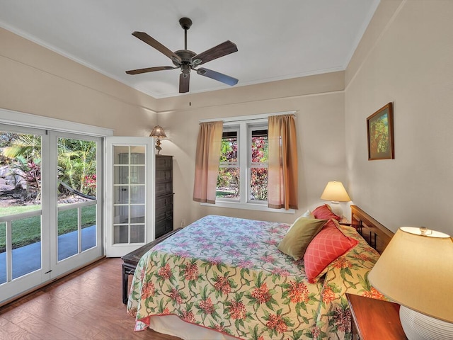 bedroom with hardwood / wood-style flooring, ceiling fan, access to exterior, and crown molding