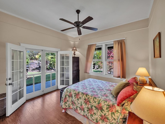 bedroom featuring ceiling fan, ornamental molding, dark hardwood / wood-style flooring, access to outside, and french doors