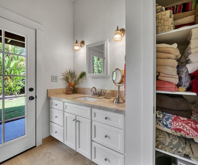 bathroom with vanity and plenty of natural light