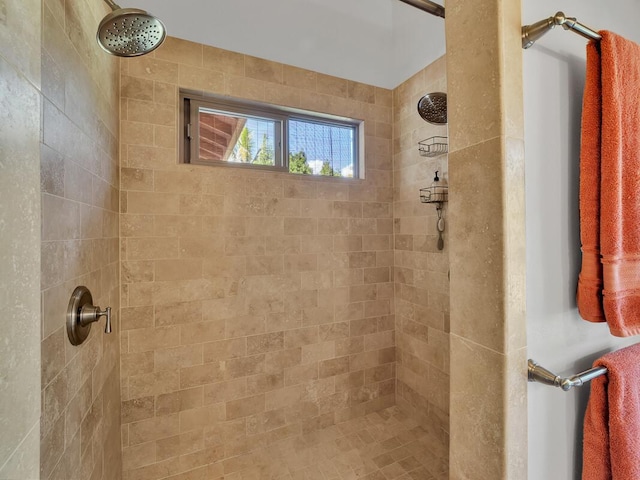 bathroom with tiled shower