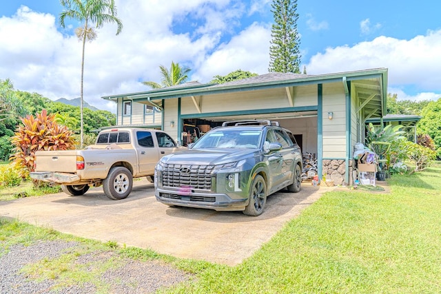 exterior space with a yard and a garage