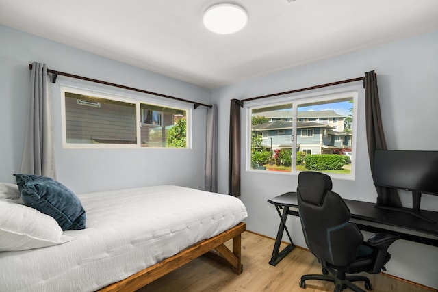 bedroom with light hardwood / wood-style flooring