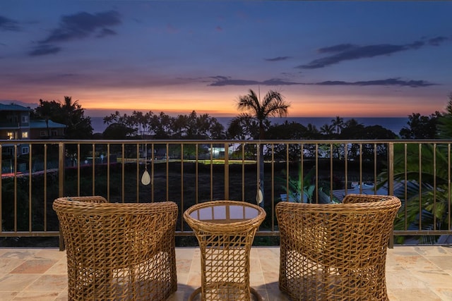 view of balcony at dusk