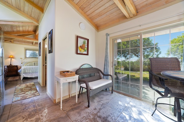 sitting room featuring wooden ceiling and vaulted ceiling with beams