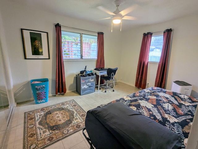 bedroom with light tile patterned floors and ceiling fan