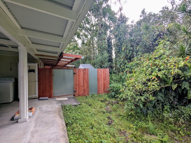 view of yard featuring washer / clothes dryer