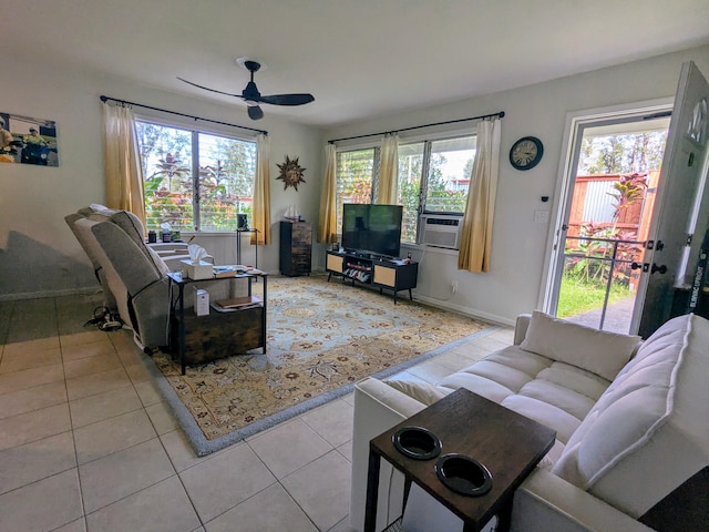 living room with light tile patterned flooring, a healthy amount of sunlight, and ceiling fan