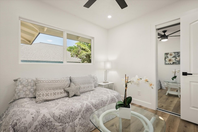 bedroom featuring hardwood / wood-style floors and ceiling fan